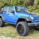 2015 Jeep Wrangler with 3.5" Rubicon lift kit, Fox shocks, Fox steering stabilizer, Fuel Grenade wheels, and 35" Nitto tires