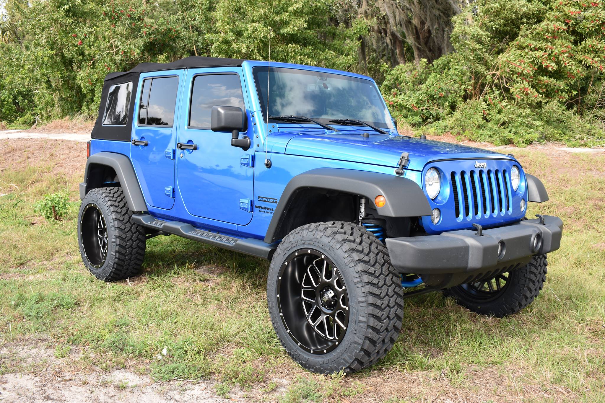 2015 Jeep Wrangler with 3.5" Rubicon lift kit, Fox shocks, Fox steering stabilizer, Fuel Grenade wheels, and 35" Nitto tires