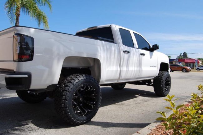 2015 Chevy Silverado with Mcgaughys Suspension truck lift kit installation in Melbourne FL Explicit Customs