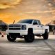2015 Chevy Silverado with Mcgaughys Suspension truck lift kit installation in Melbourne FL Explicit Customs