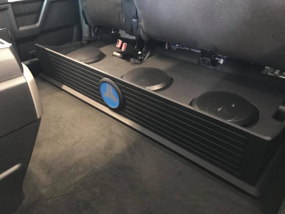 Ford F250 subwoofer box installation under rear seat by Explicit Customs Melbourne FL